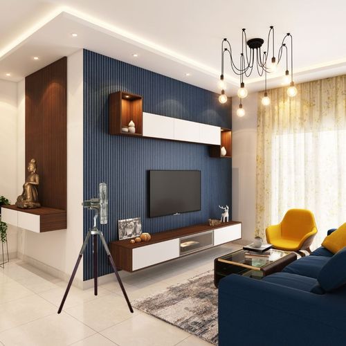Salle de séjour moderne avec meuble TV mural et fauteuils colorés.